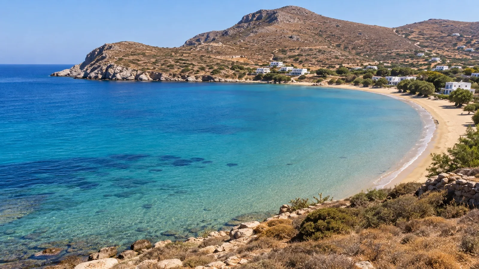 Sandy sheltered beach and clear water on Syros