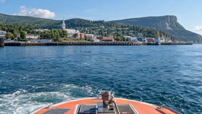 Tender boat approaching Gaspé waterfront in Quebec