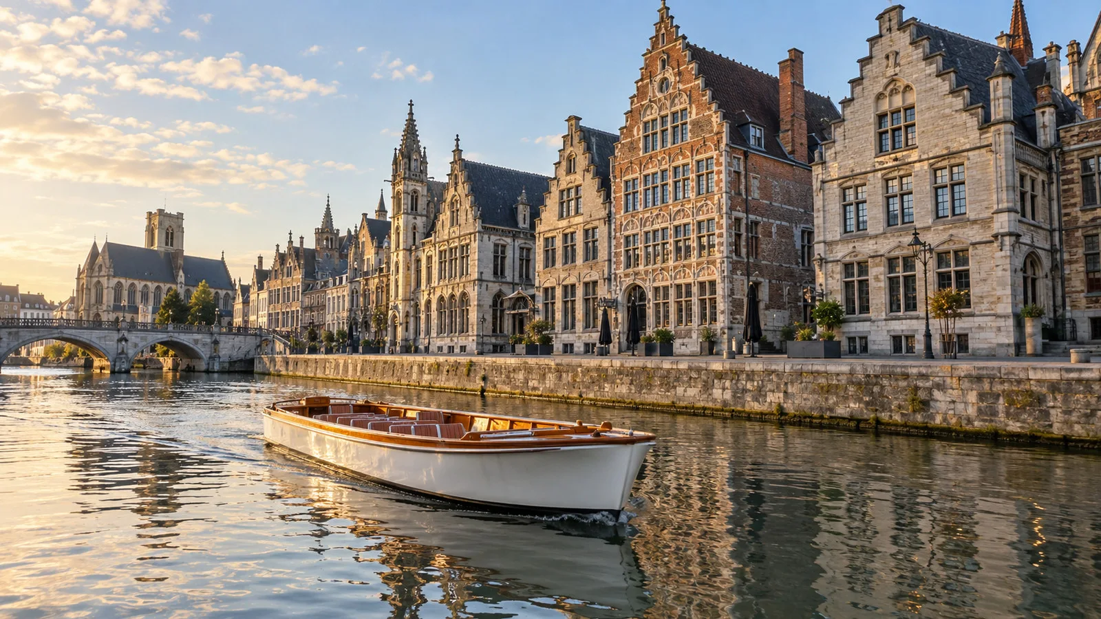 a small open canal boat gliding past Ghent's historic Graslei and Korenlei facades, no passengers visible