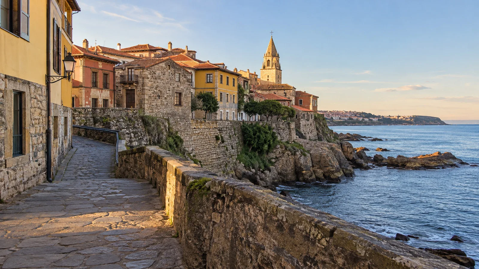 Cimavilla old quarter Gijon Asturias stone lanes and coastal headland with historic houses, no people
