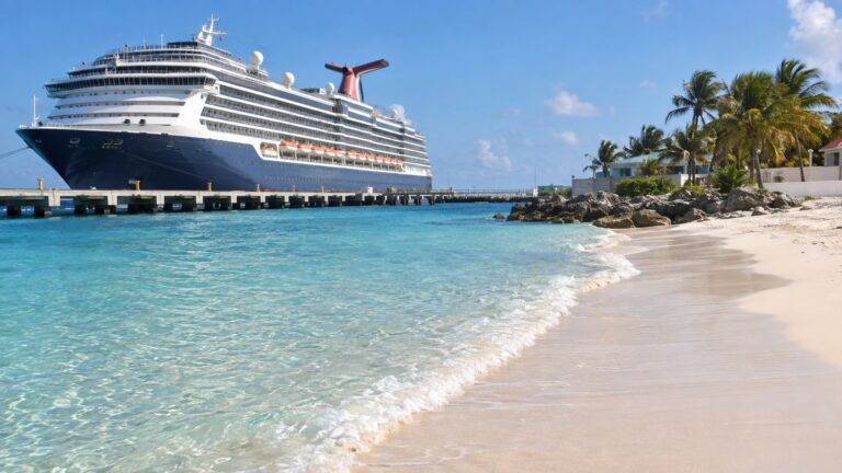 Empty beach beside Grand Turk cruise pier with ship close to sand