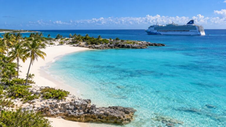 Cruise ship offshore from Great Stirrup Cay's white beach and turquoise water