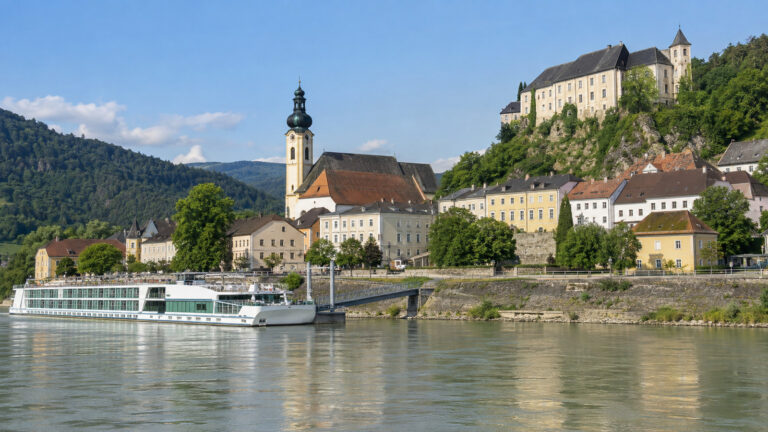 Danube river cruise landing below Grein's historic riverfront, Austria