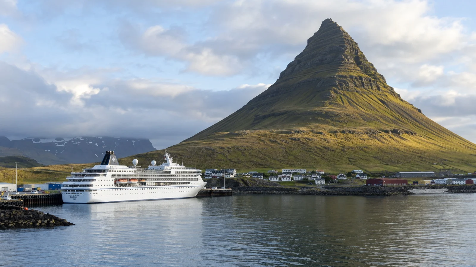 Cruise ship in Grundarfjörður harbor near Kirkjufell mountain
