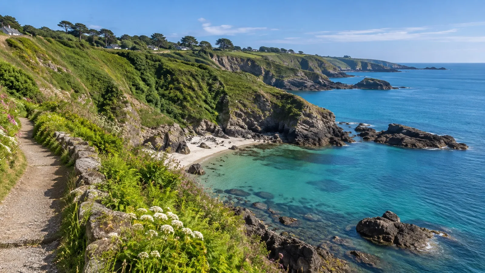 Green cliffs and a sheltered cove on Guernsey’s coast