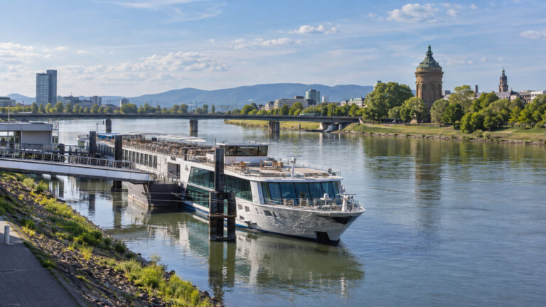 Rhine river cruise ship moored at Mannheim river landing, Germany, for a Heidelberg excursion