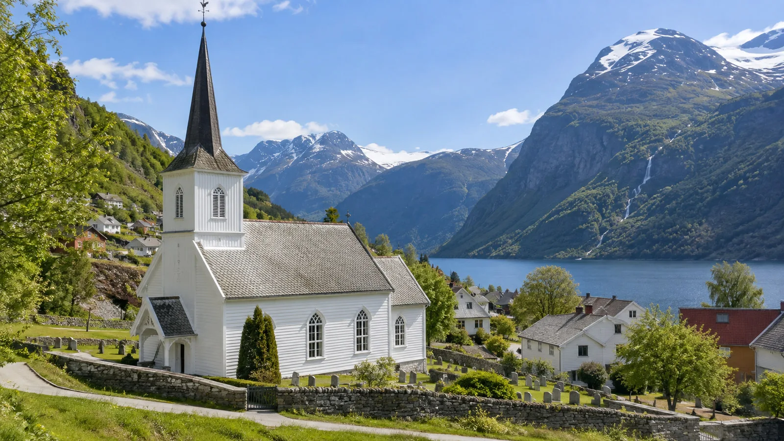 Sunnylven Church Hellesylt white wooden church with village and fjord mountains behind, no people