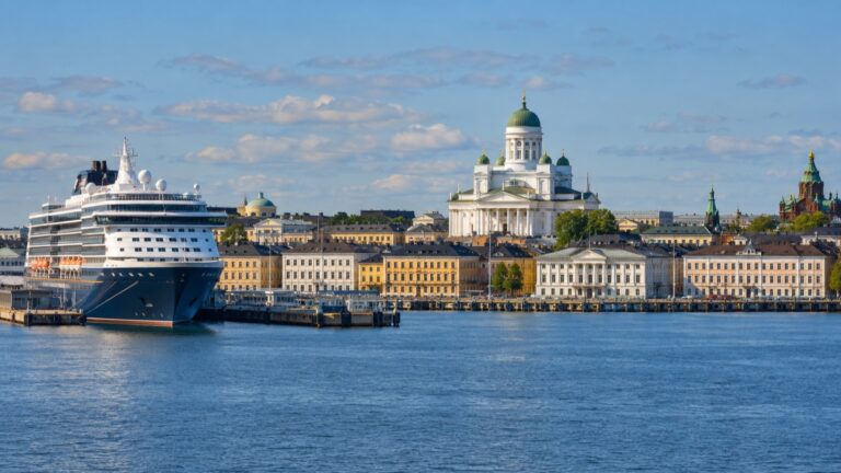 Cruise ship in Helsinki harbor with the white cathedral beyond