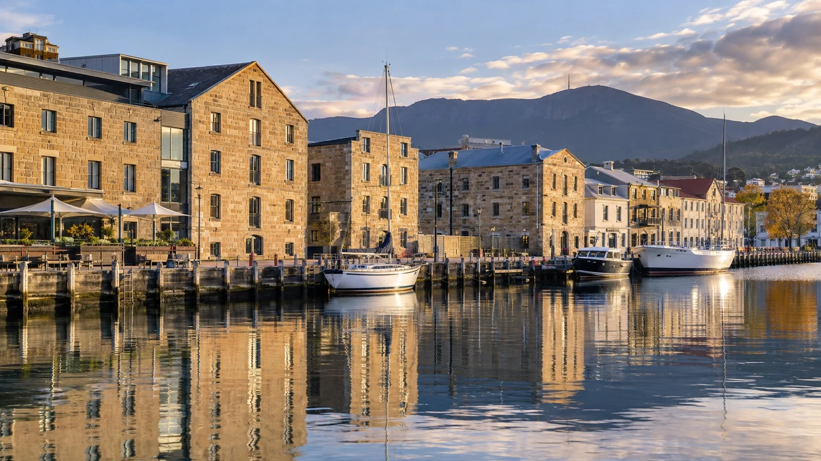 Hunter Street waterfront in Hobart with restored sandstone warehouses, small hotels and harbor water