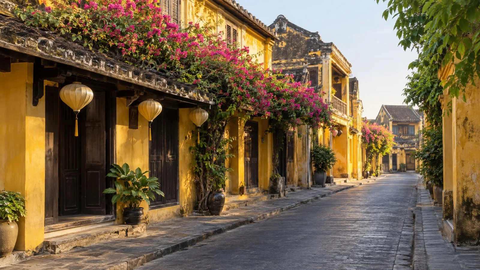 Yellow historic merchant houses along a quiet lane in Hoi An Ancient Town