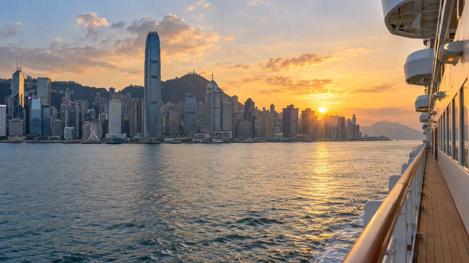 View from cruise ship entering Hong Kong Victoria Harbour at sunset