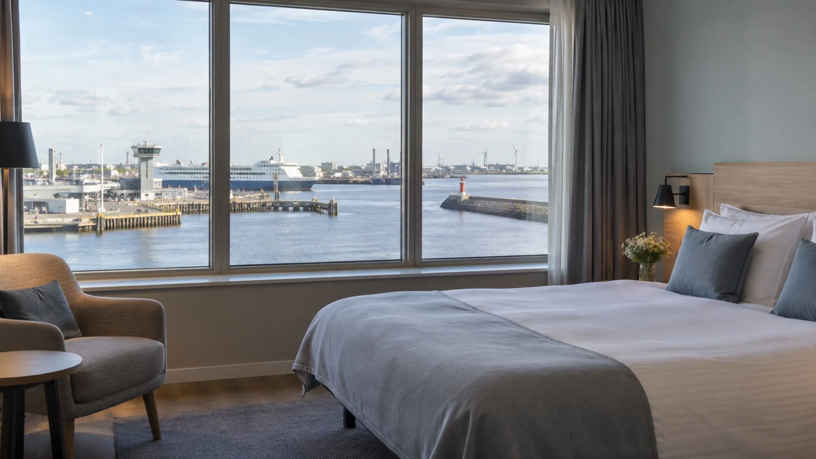 Empty simple unbranded Dutch hotel room near IJmuiden with harbor view