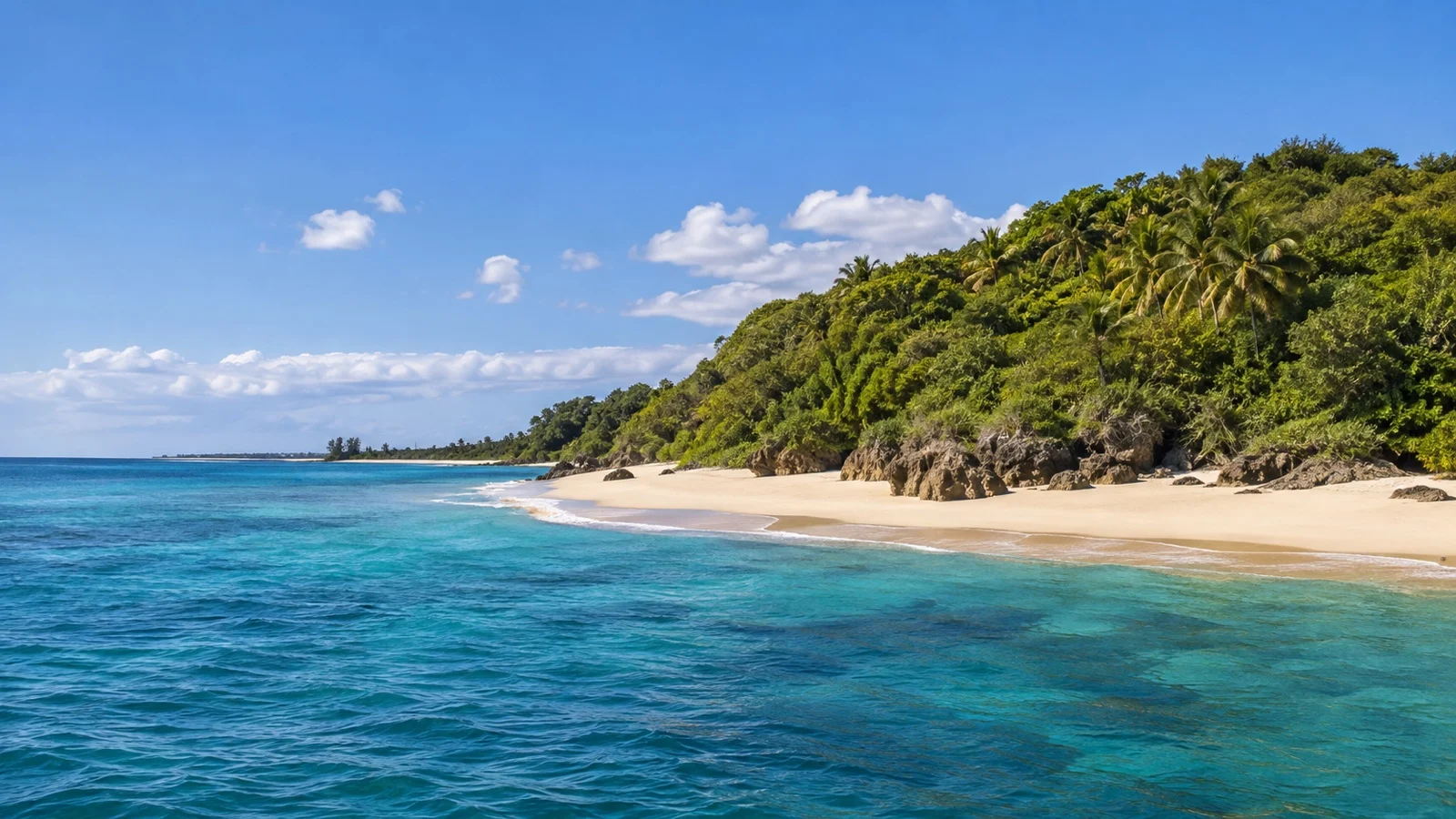 Green Inhaca Island coastline and beach across the water from Portuguese Island, Mozambique