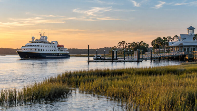 Small expedition cruise vessel or tender near Jekyll Island Georgia marina waterfront with tidal marsh, no people