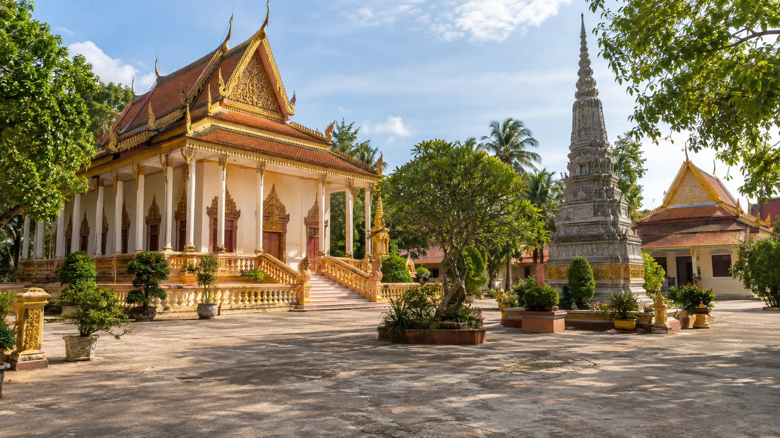 the Buddhist temple buildings and courtyard of Wat Kampong Tralach Leu in rural Cambodia, empty and peaceful