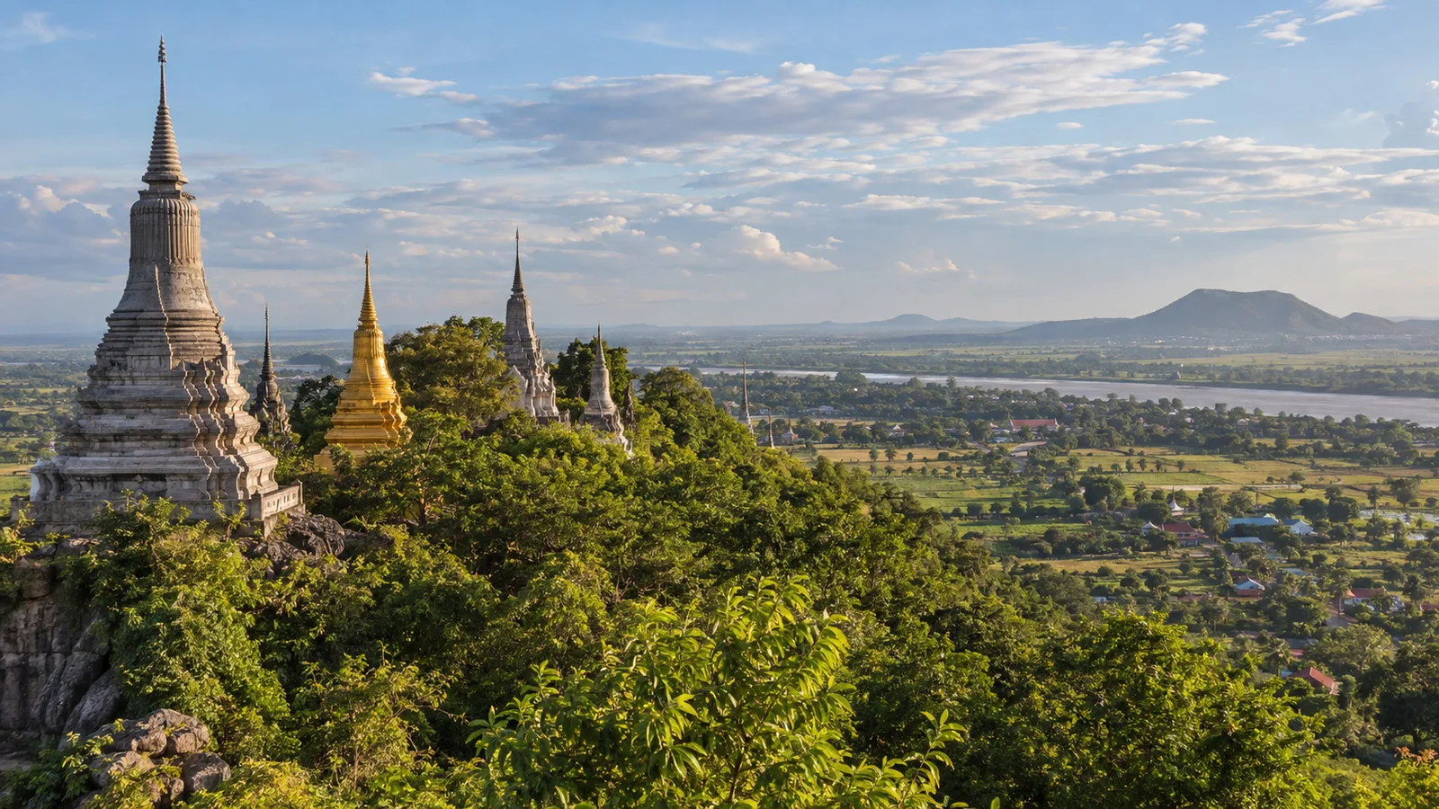 the hilltop stupas of Oudong former royal capital in Cambodia with lush green countryside below