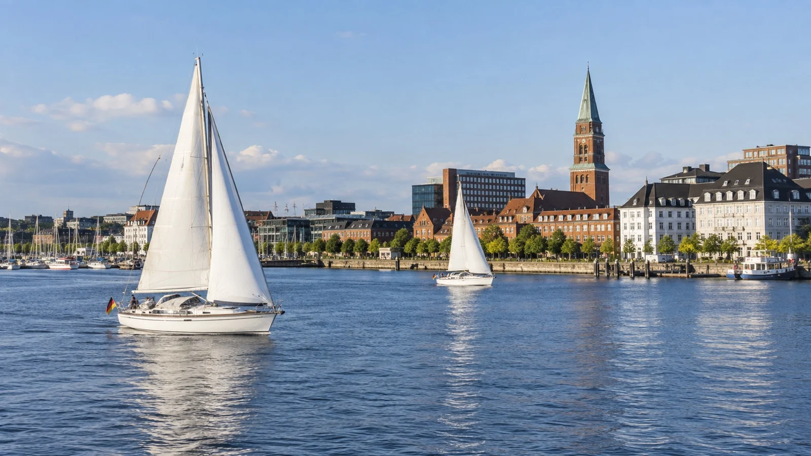 Sailboats on Kiel Fjord near hotel districts