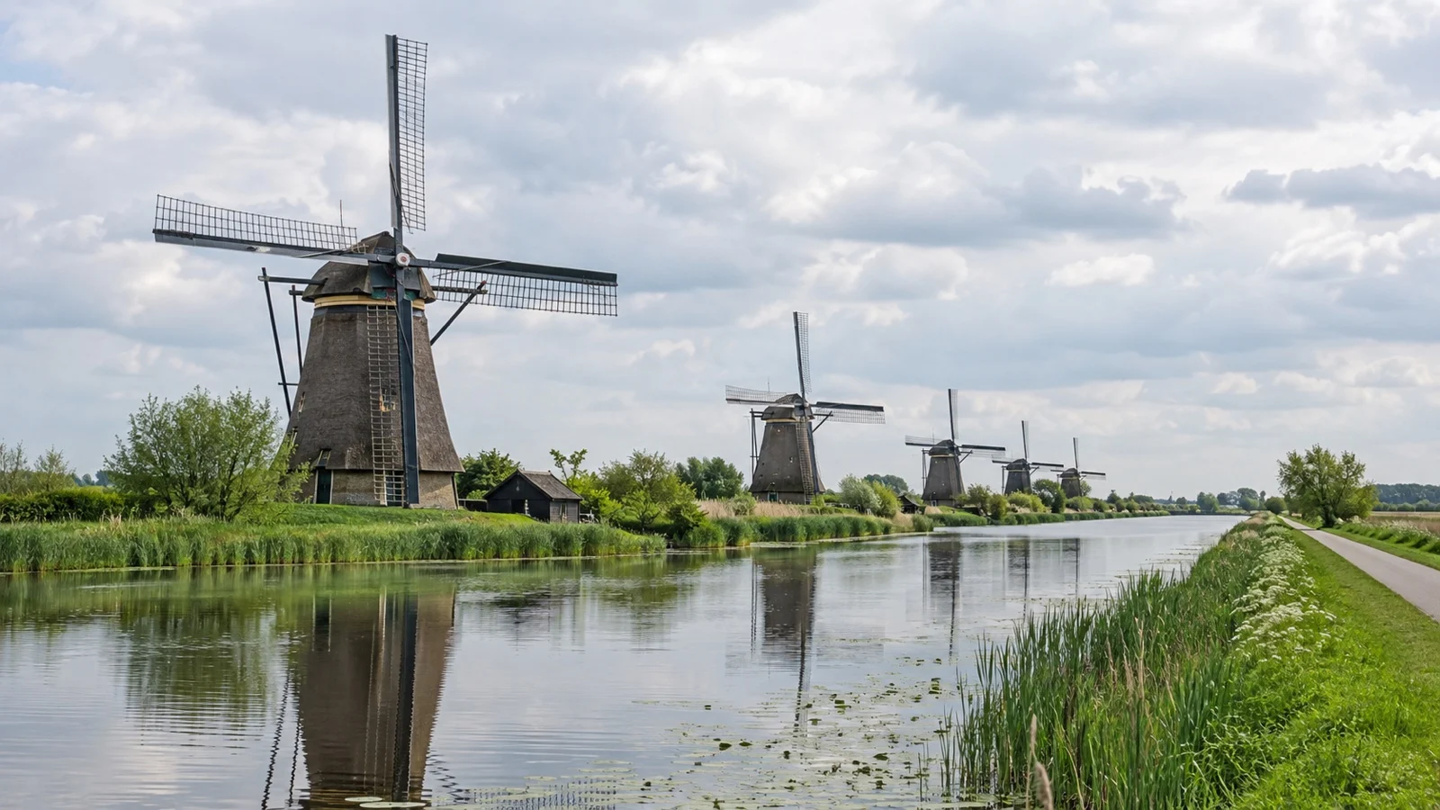 Historic Kinderdijk windmills beside a Dutch canal