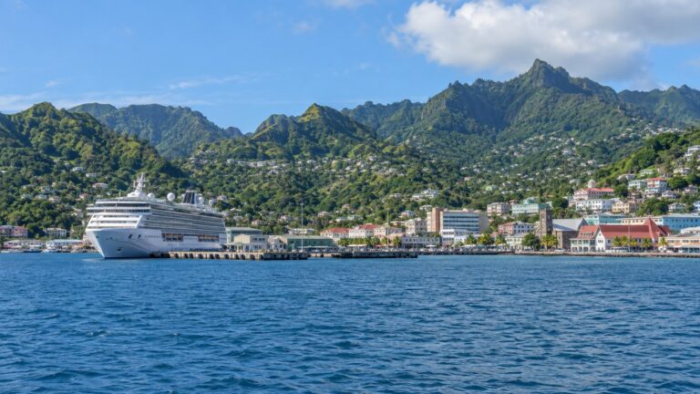 Cruise ship at Kingstown harbor below the green hills of Saint Vincent