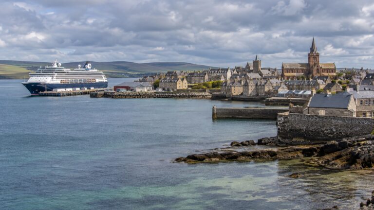 Cruise ship in Kirkwall harbor beside the stone town
