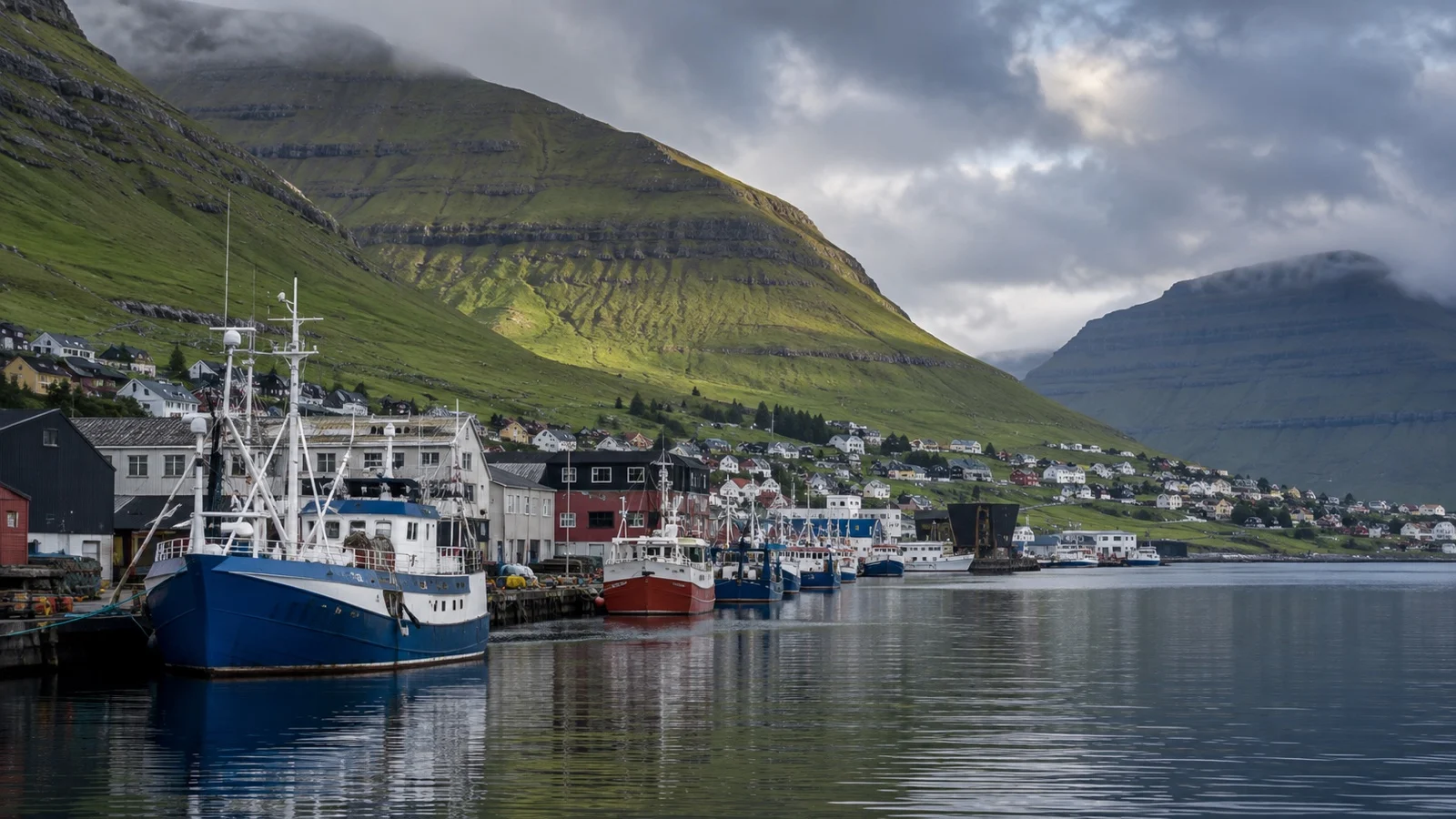 Klaksvík harbor beneath steep green Faroese mountains