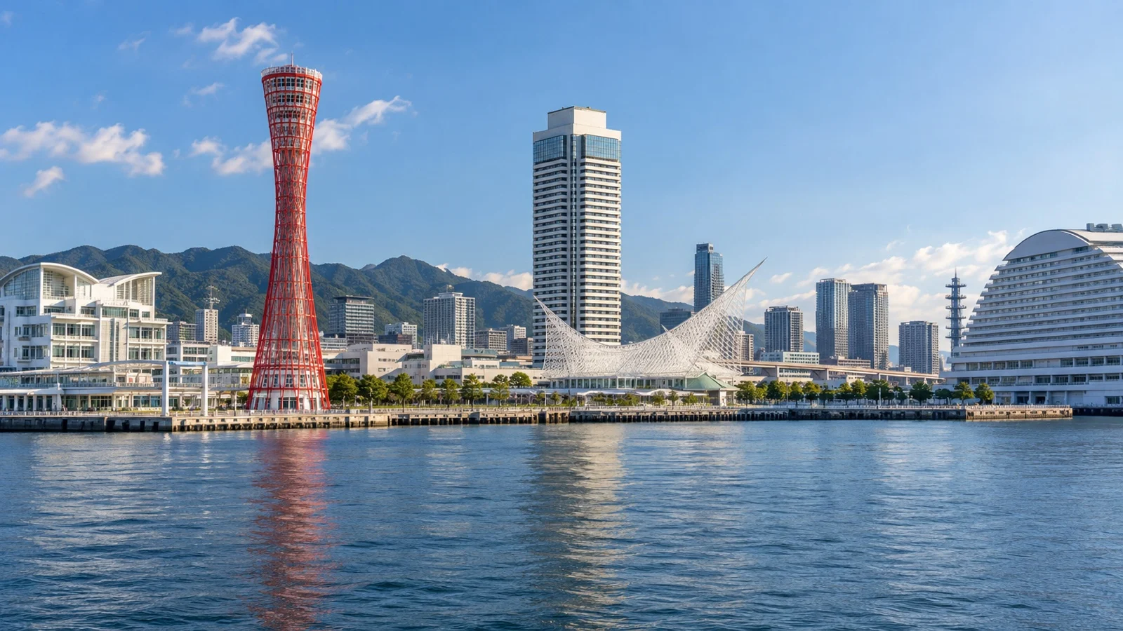 Kobe harborfront with Meriken Park, modern hotels, red Kobe Port Tower and city skyline