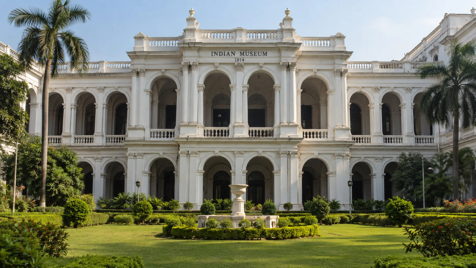 Indian Museum Kolkata historic colonial facade with columns and landscaped front, no people