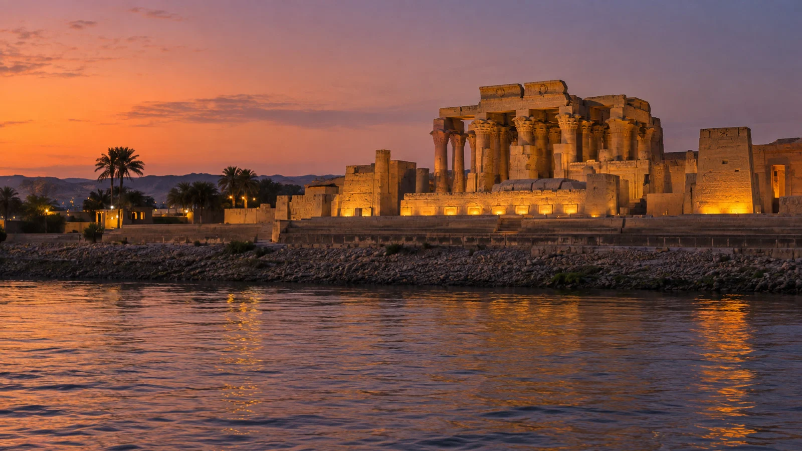 Kom Ombo temple lit at dusk above the Nile