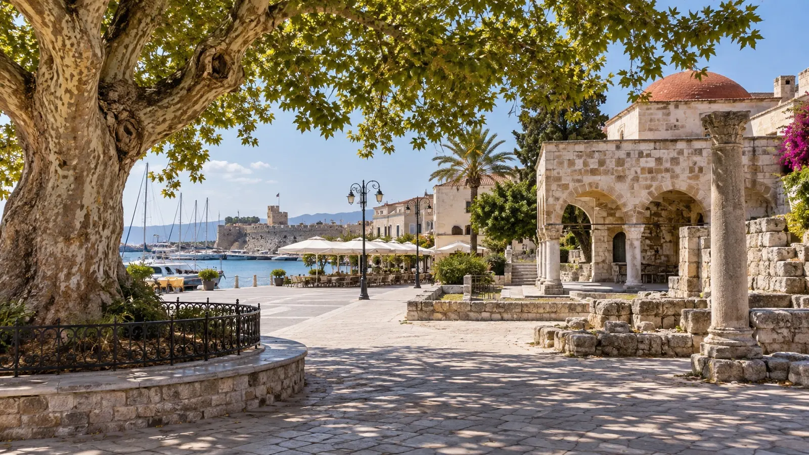 Historic stone buildings and plane tree in Kos Town