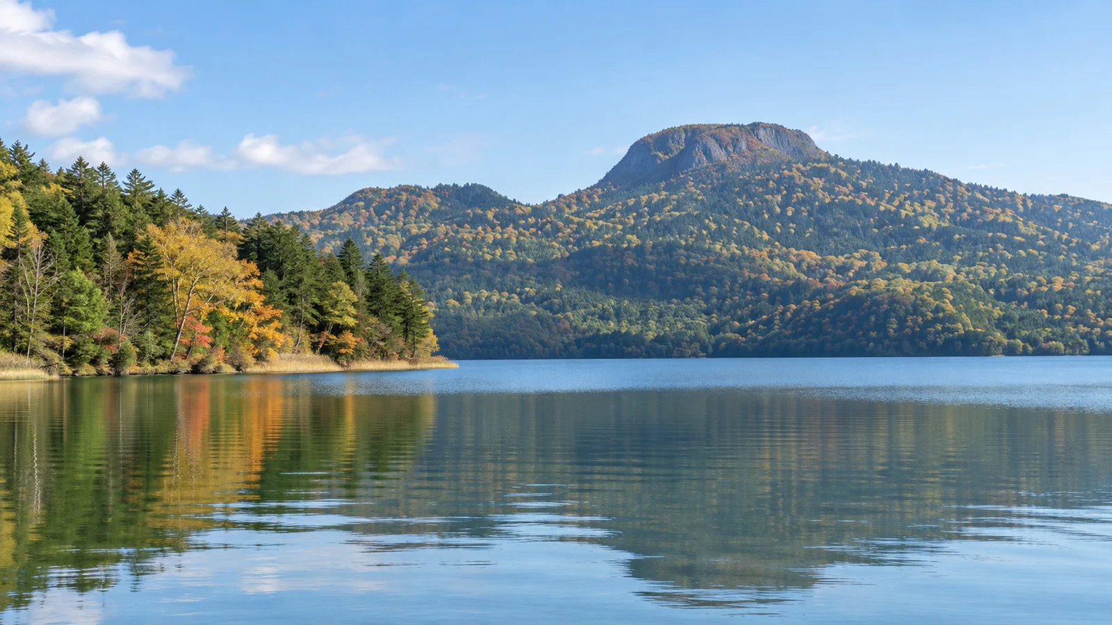 Lake Akan shoreline and wooded mountains in eastern Hokkaido
