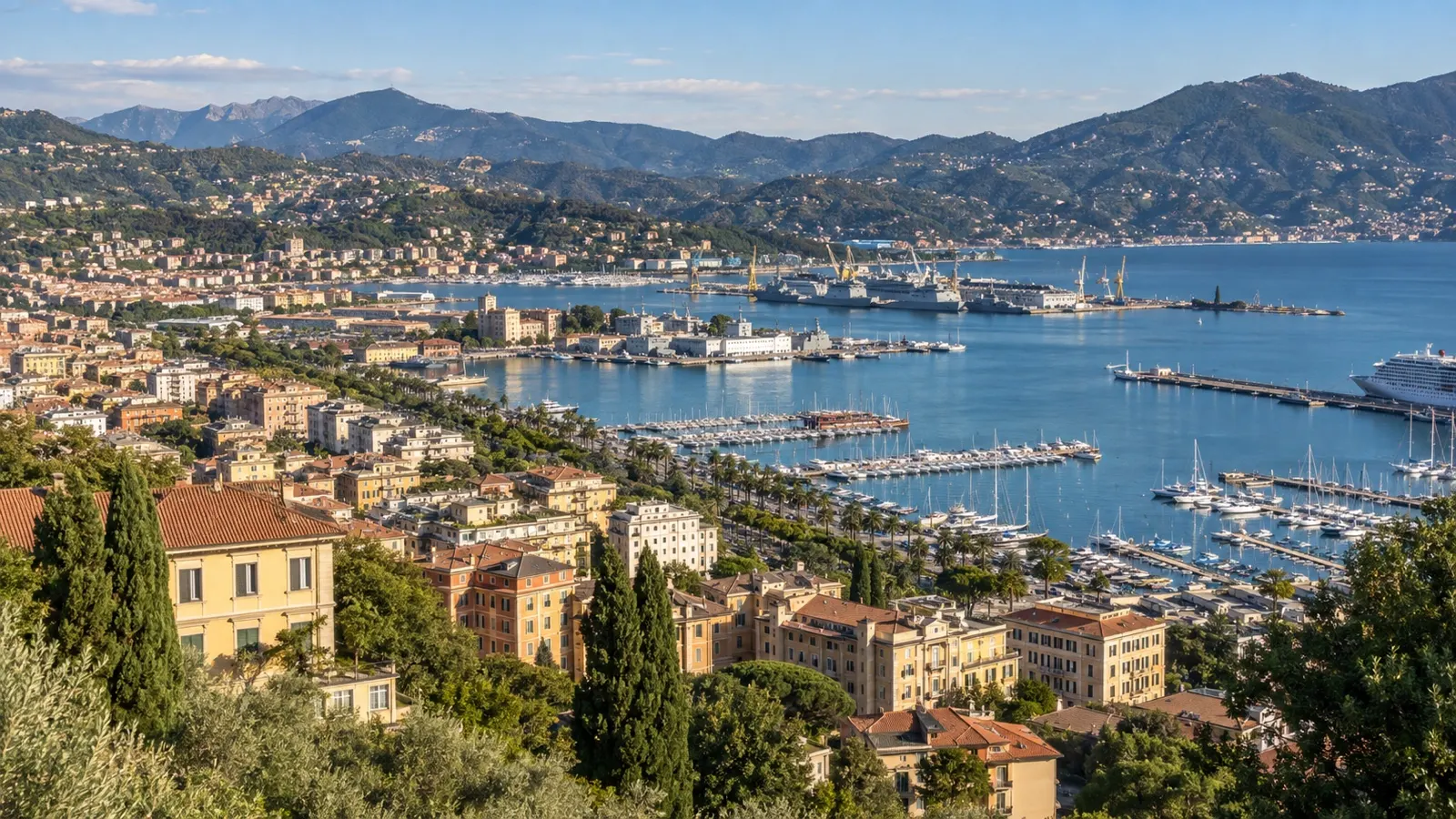 Panoramic La Spezia harbor and city hotel districts with hills around the gulf