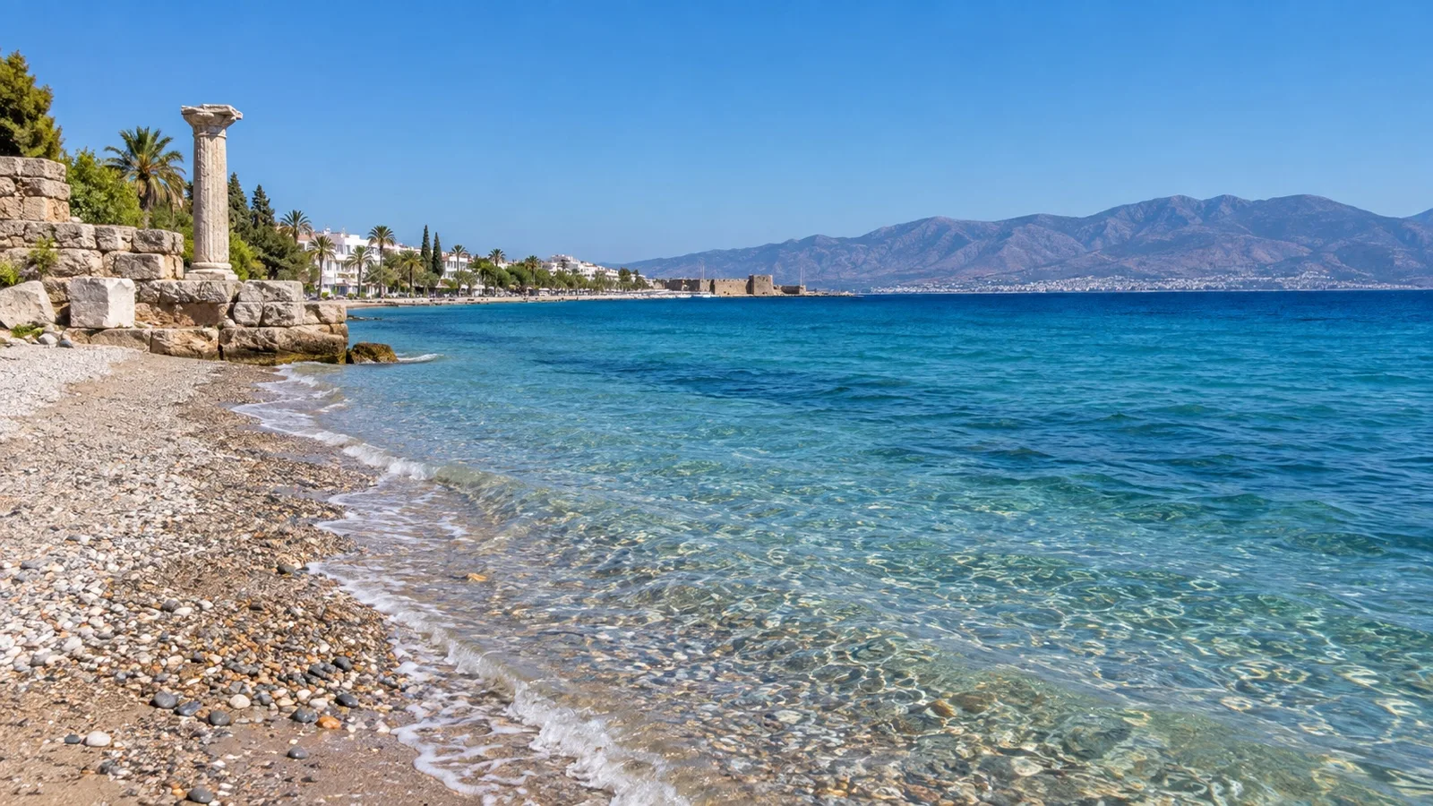 Pebbly shore and clear Aegean water at Lambi Beach on Kos