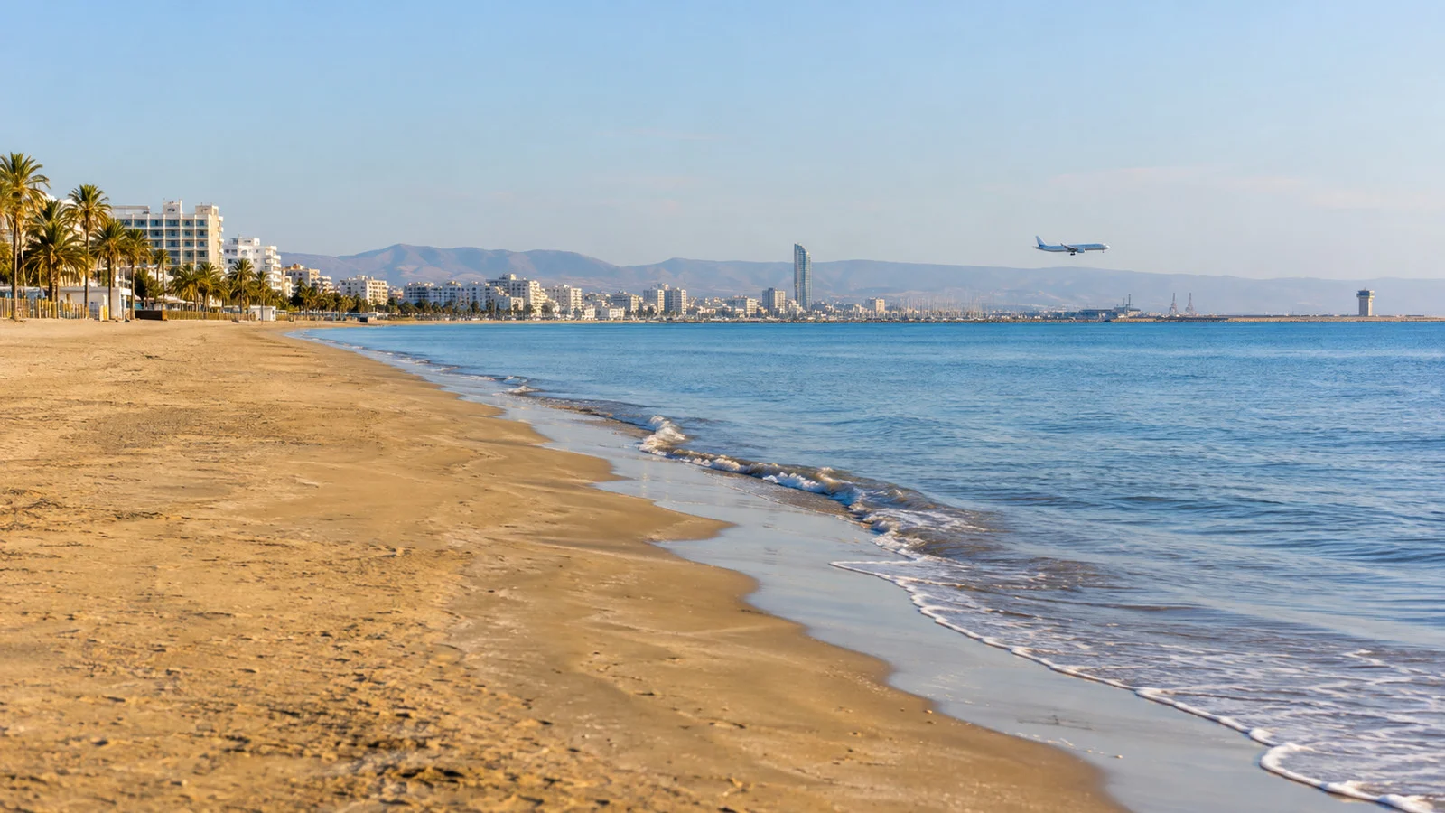 Golden sand and blue water at Mackenzie Beach in Larnaca