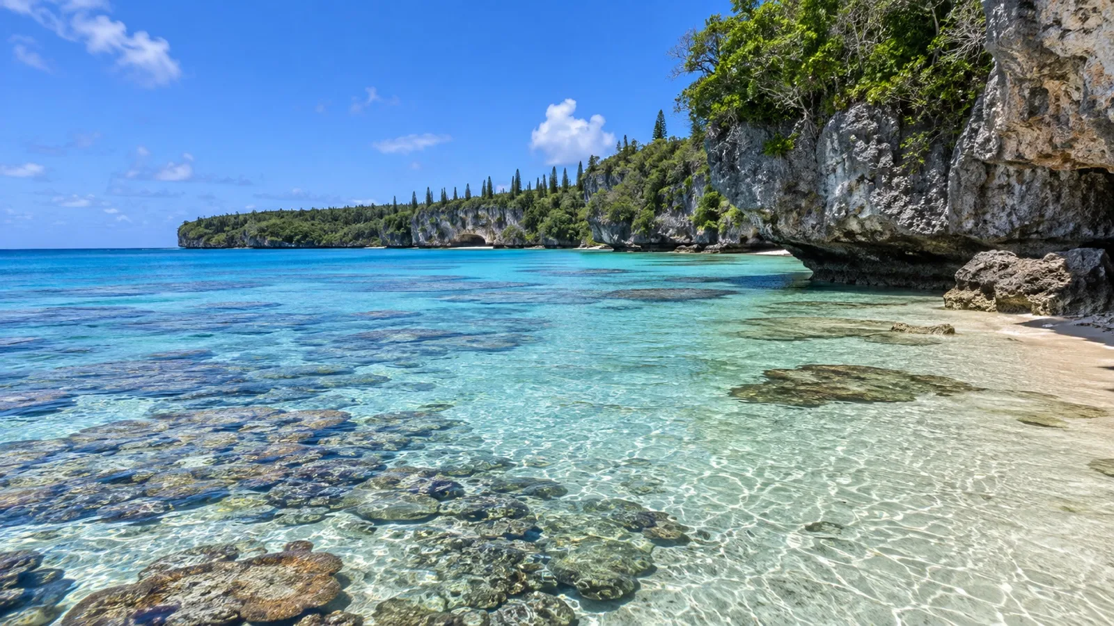 Clear shallow water above the protected reef at Lifou’s Jinek Bay