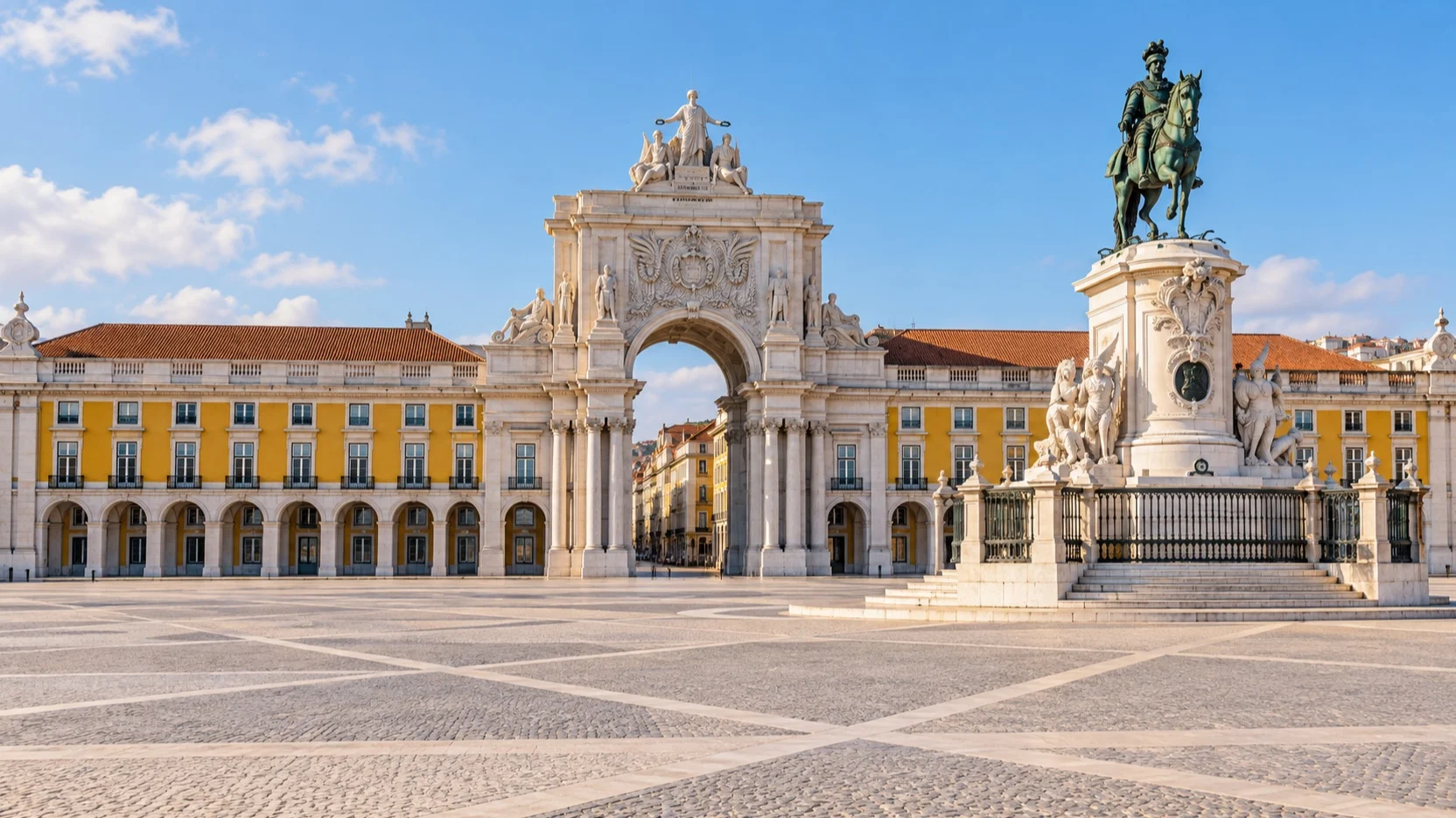 Praça do Comércio with its central arch and yellow arcades in Lisbon