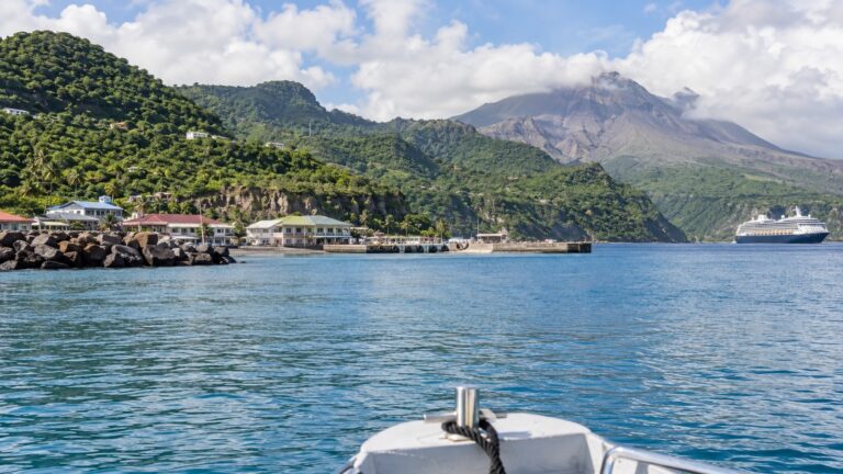 Tender boat approaching Little Bay harbor in Montserrat