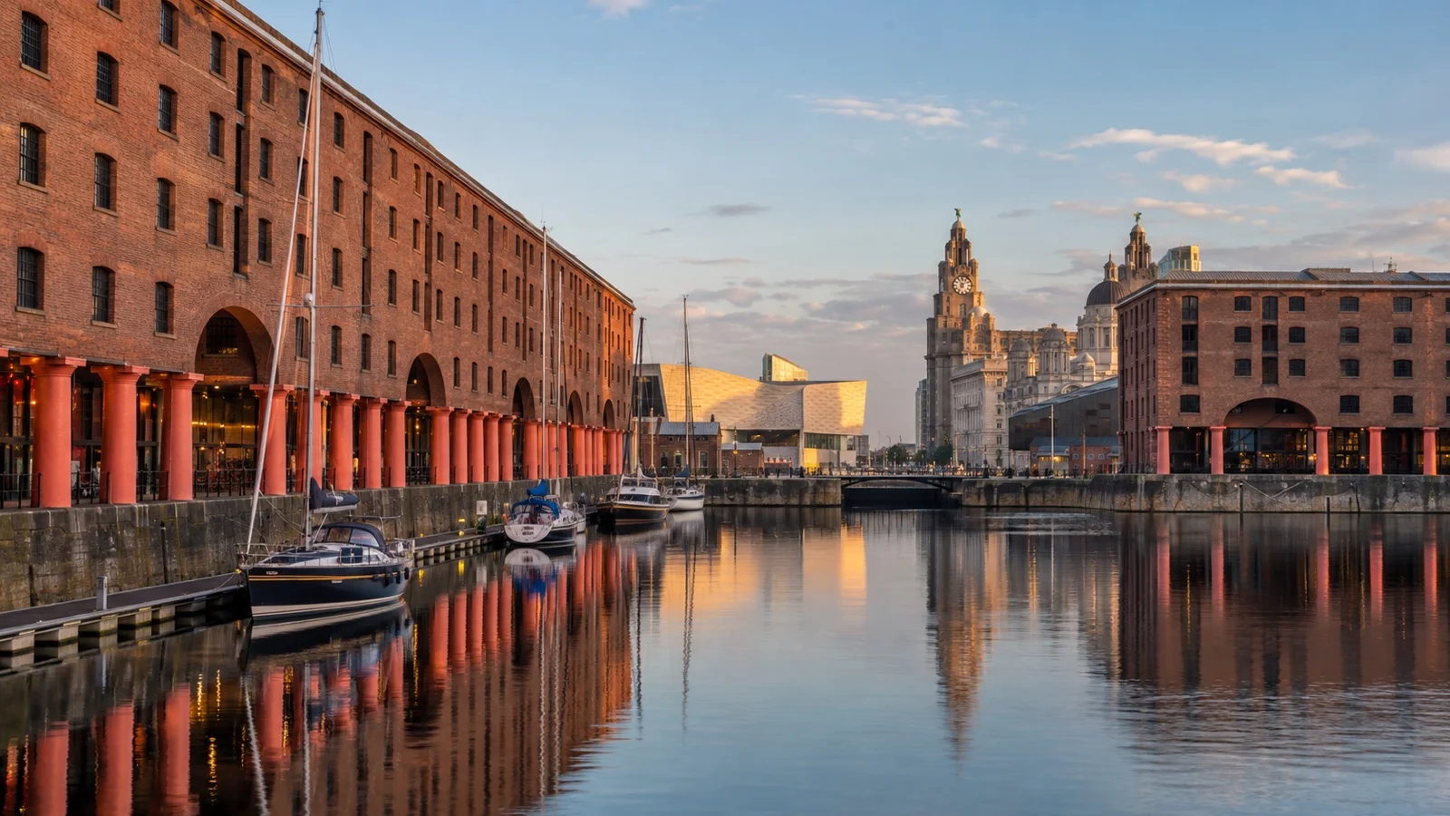 Royal Albert Dock in Liverpool with restored brick warehouses, boutique hotels and calm dock water