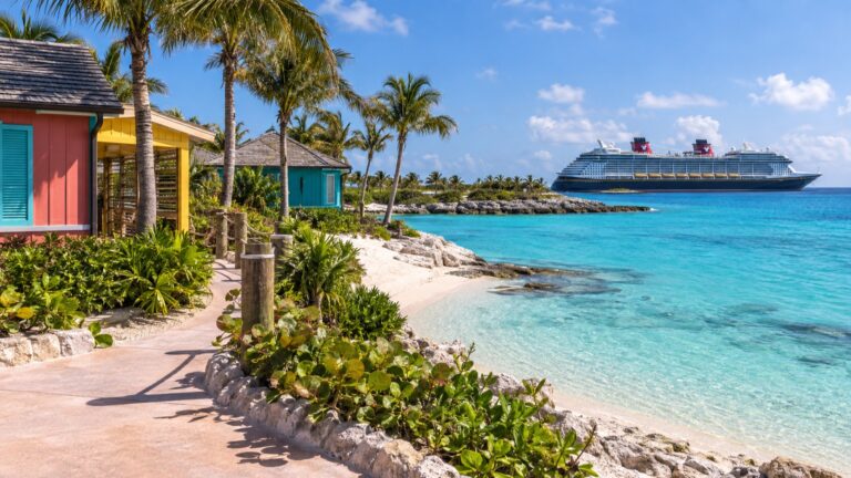 Disney cruise ship offshore from Lookout Cay's colorful Eleuthera waterfront