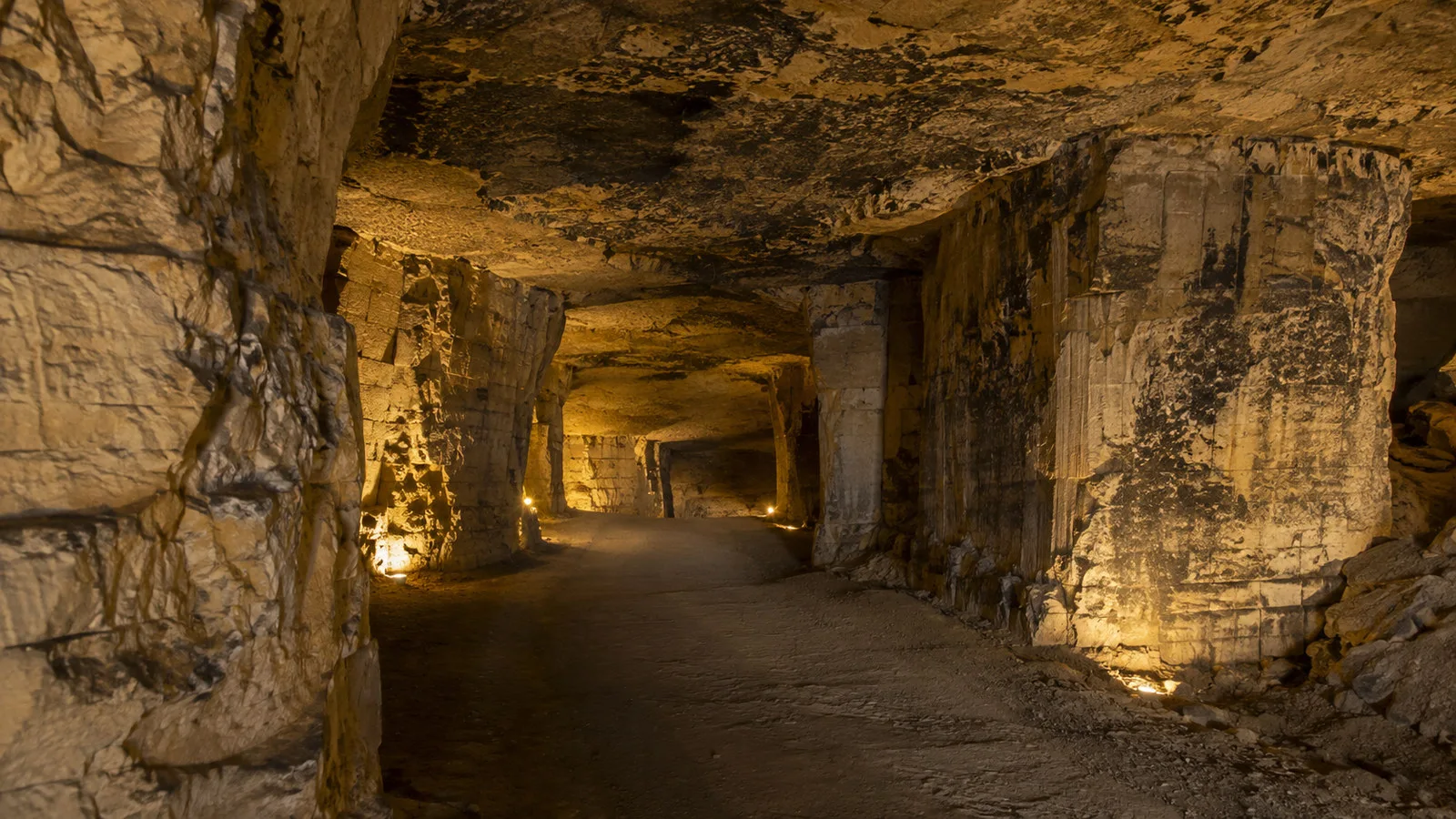 Limestone cave passage beneath St. Pietersberg with warm low light