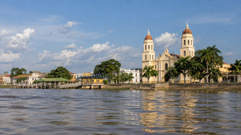 Magangué riverfront and cathedral seen from a boat on the Magdalena River