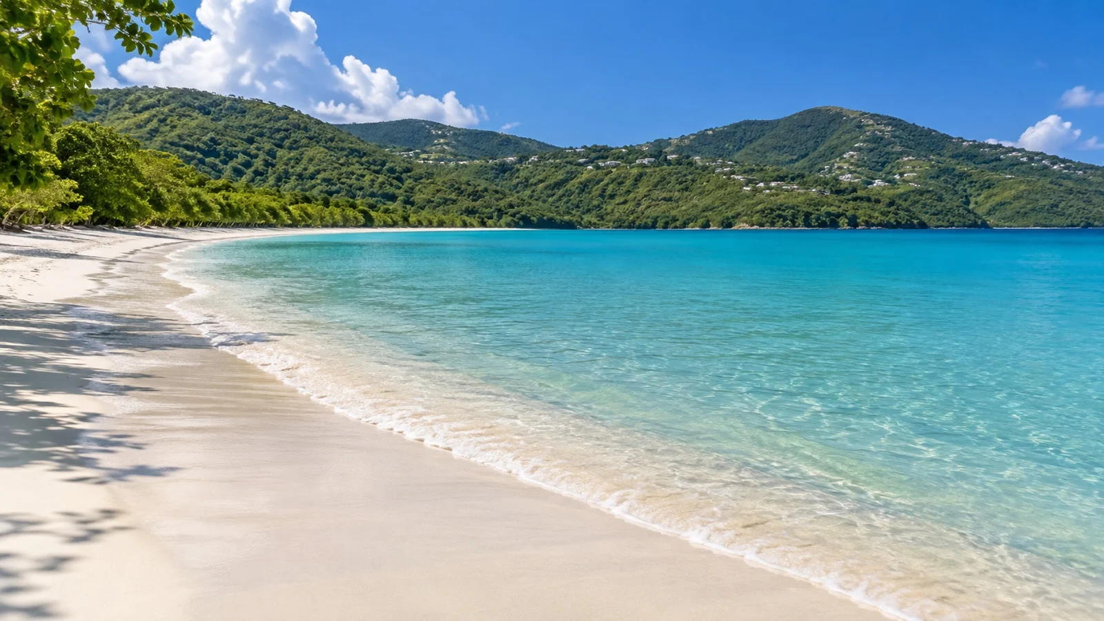 Curving beach and green hills at Magens Bay, Saint Thomas