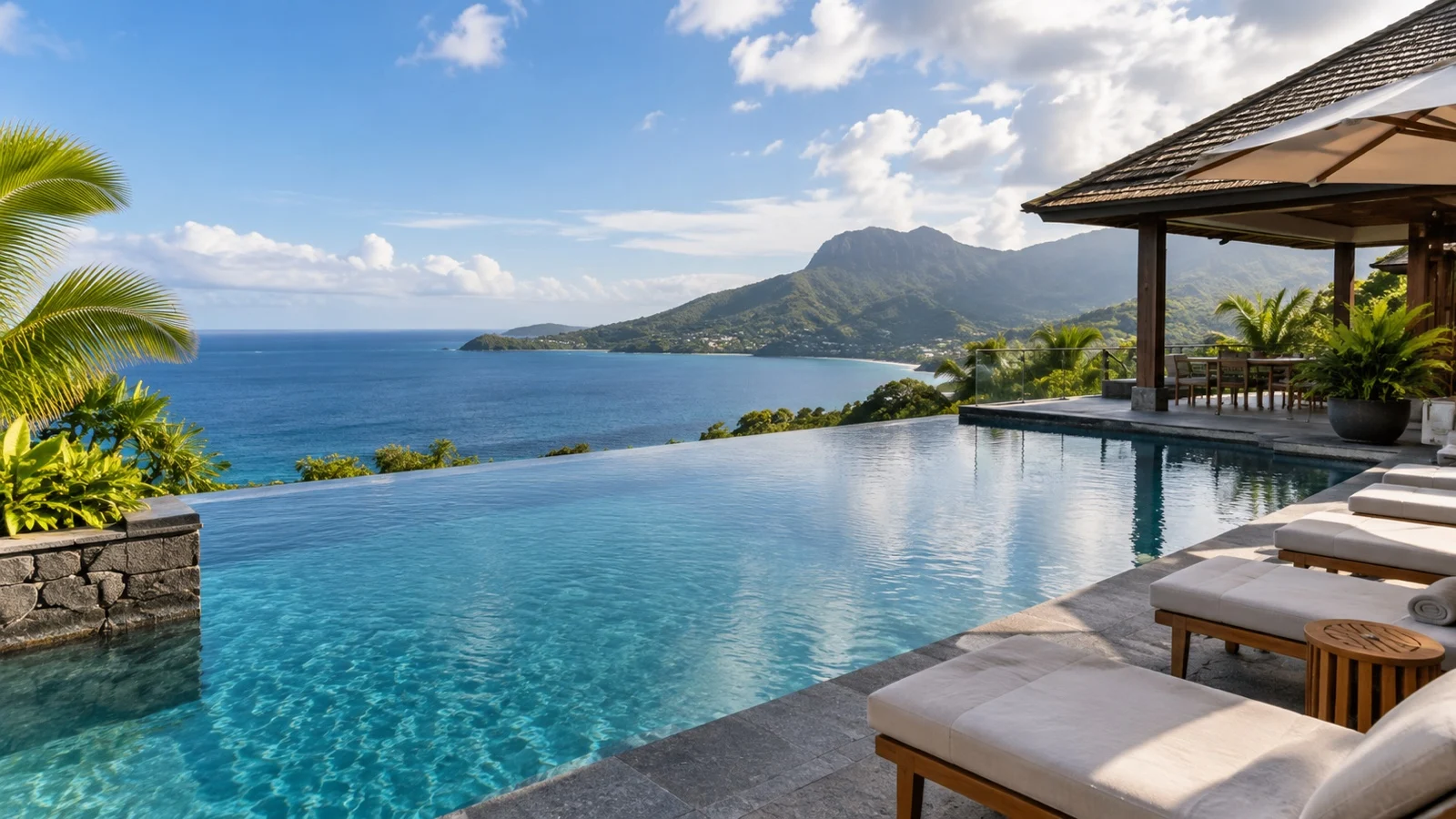 Empty pool terrace at an unbranded Mahé island hotel overlooking the Indian Ocean