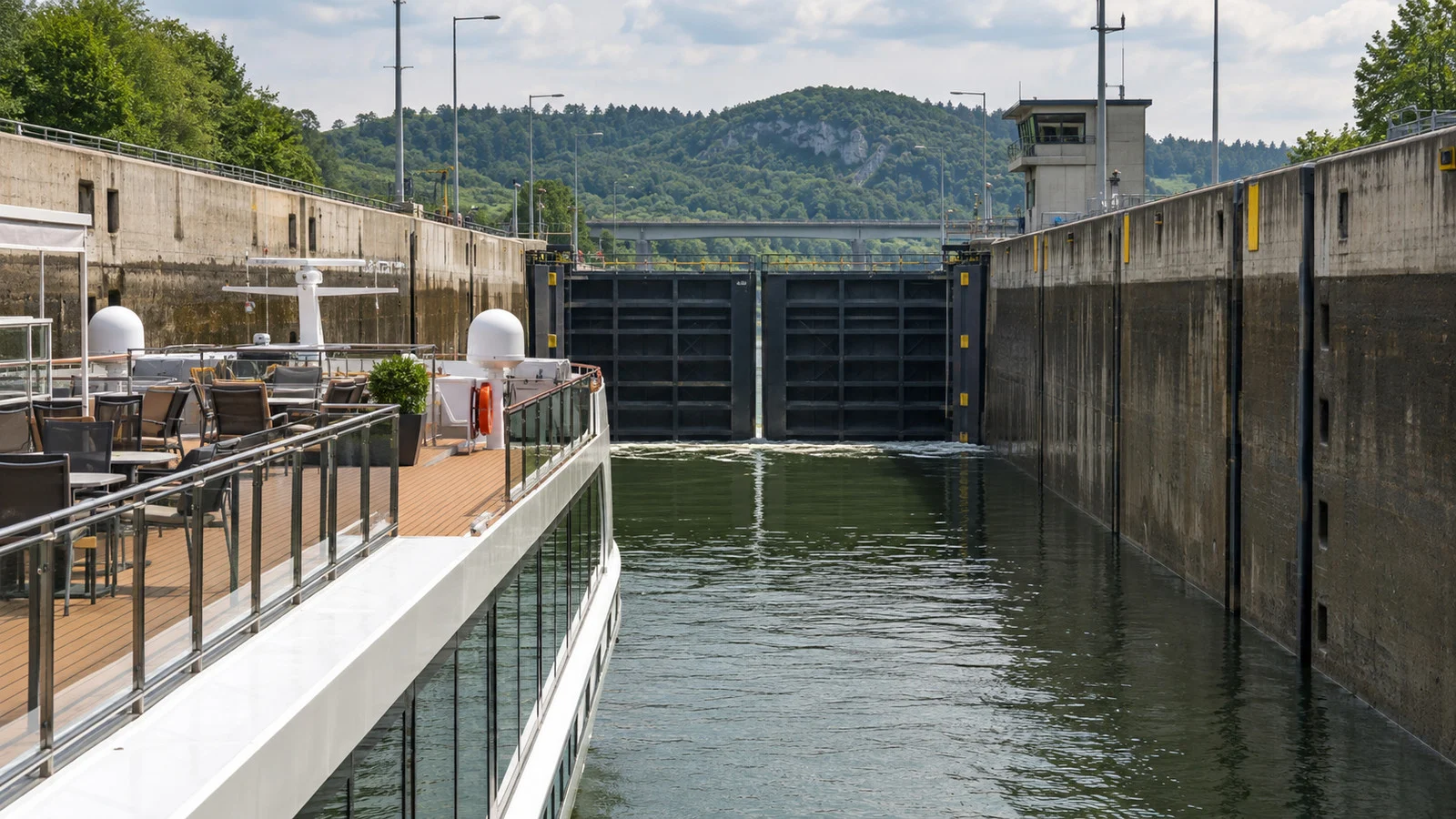 a European river cruise ship inside a modern concrete lock chamber on the Main-Danube Canal in Bavaria