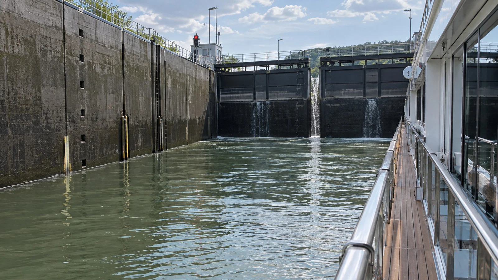 close view of lock gates and rising water around a river cruise ship in a Main-Danube Canal lock