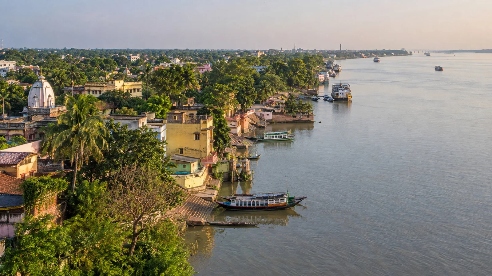 Aerial view of Matiari village beside the Hooghly River with boats along the riverbank
