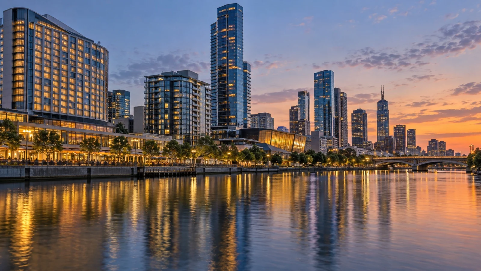 Upscale Melbourne Southbank waterfront hotel buildings reflecting in the Yarra River at dusk