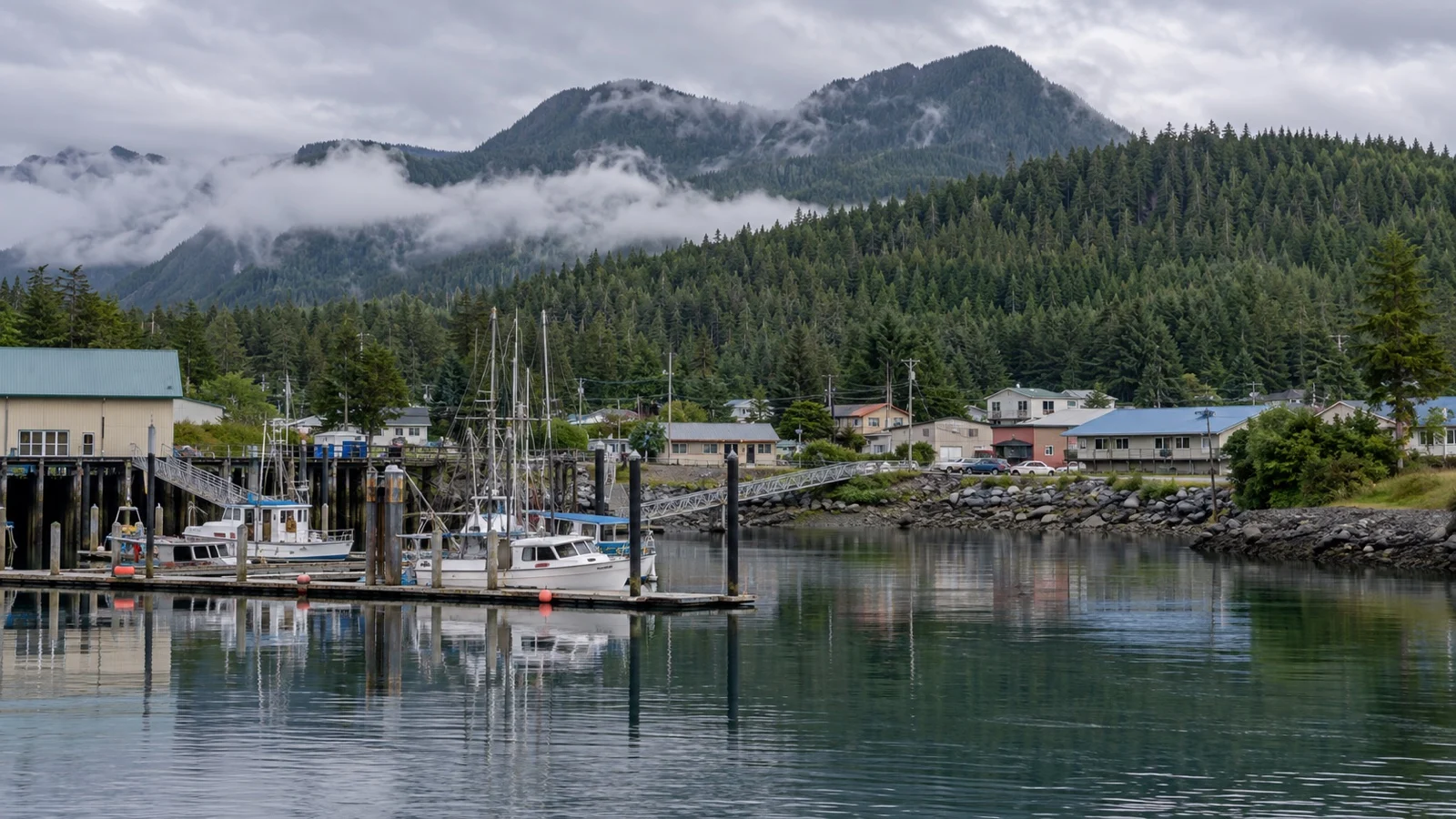 Metlakatla waterfront and fishing boats beside forested shores