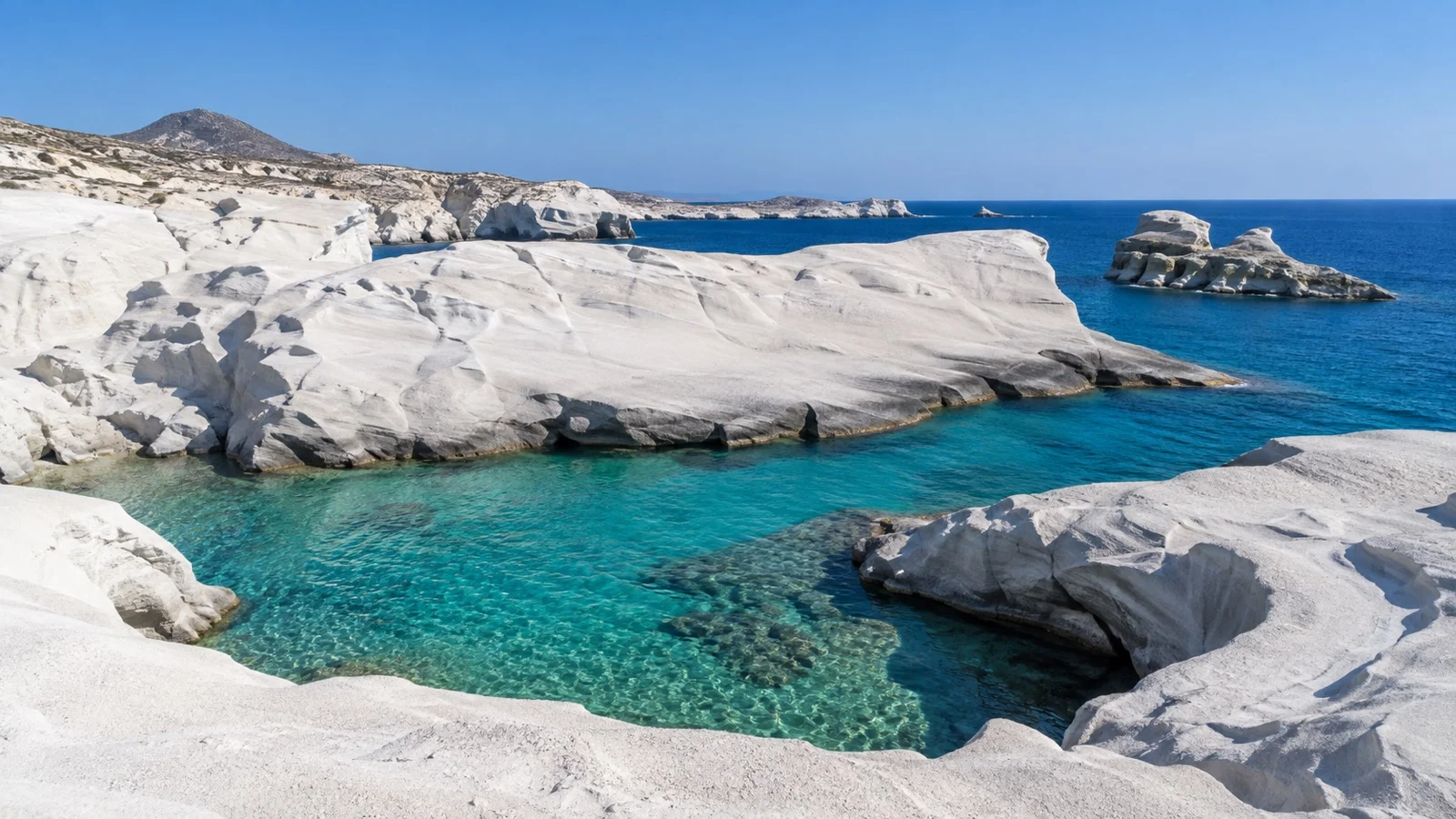 Smooth white volcanic rock and turquoise water at Sarakiniko on Milos