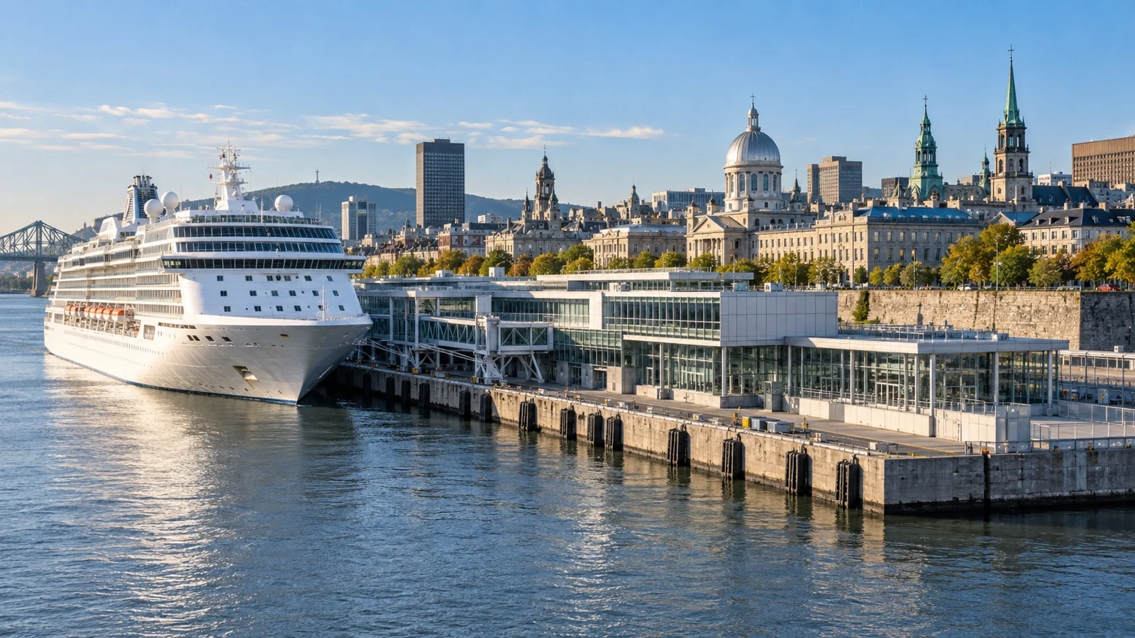Grand Quay cruise terminal in Old Montréal with a white cruise ship beside the St. Lawrence River and historic city skyline