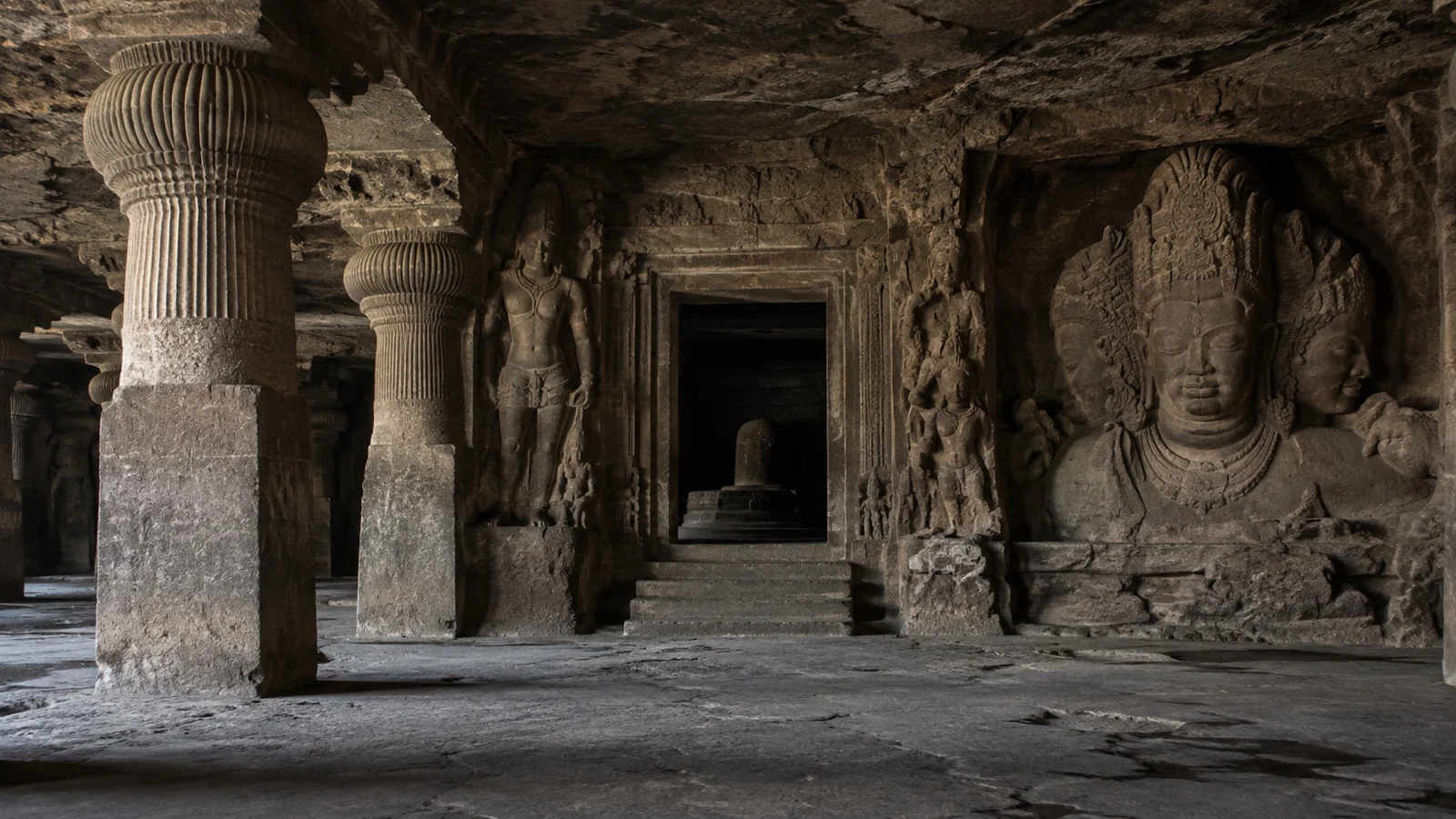 Rock-cut stone columns inside the Elephanta Caves near Mumbai